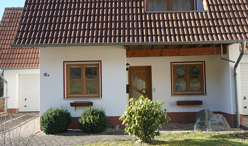Detached house in new development area on the edge of the forest with stream on the property