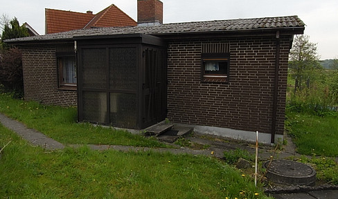 kleines Einfamilienhaus mit Kamin und Grundstück