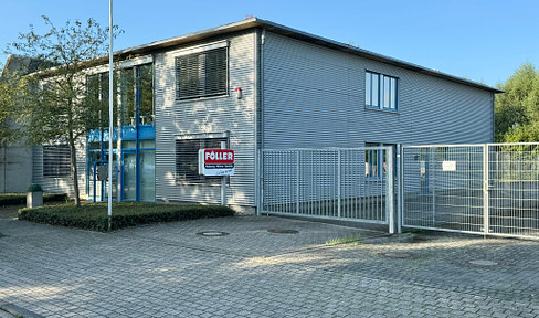 Modern office building with warehouse and ample parking spaces