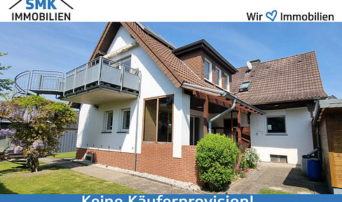 Modernized two-family house with garden, garage & carport!