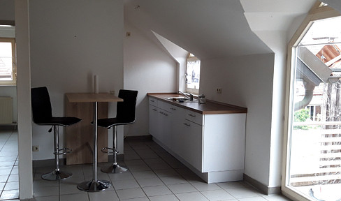 Cozy 2-room apartment with balcony on the top floor, located in the heart of Bad Bergzabern.