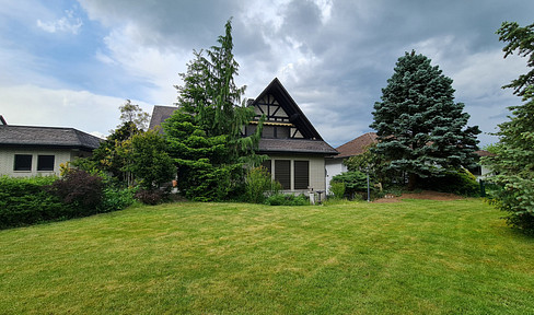 Country house with pretty plot on the outskirts of the village