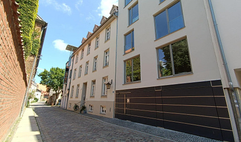 Attic maisonette apartment with a garage, playground, and 2 terraces, located in the old town of Stralsund.