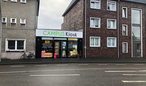 Store with large shop window front in the intersection area, near St Georg Gymnasium