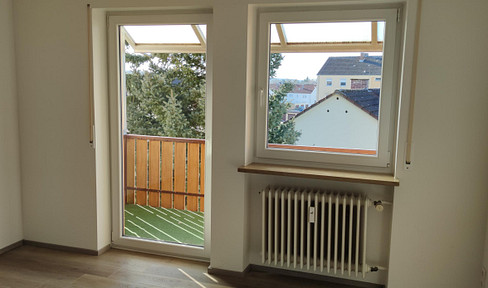 Beautiful 2.5-room apartment on the 3rd floor, featuring a fitted kitchen, balcony, and garage.