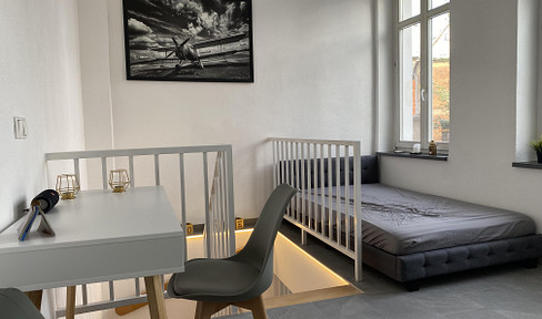 # Frisch renoviertes Design-Apartment – voll möbliert, 2 Bäder & Garten inkl. WLAN in zentraler Lage