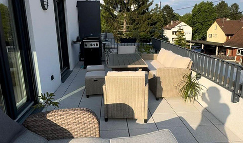 New construction: 2-room penthouse apartment, never occupied before, with balcony and fitted kitchen. Available from July 1st, KfW 40+ standard.
