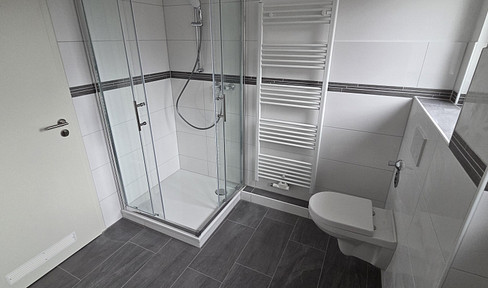 Beautifully renovated 3-room apartment, possibly with a garage parking space.