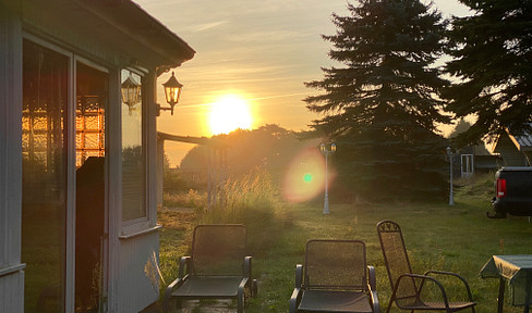 2000 square meters of land on the Baltic Sea, with a small bungalow in the surrounding area.