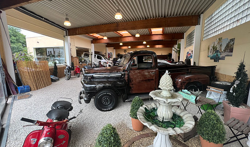 Car dealership + approx. 15 outside parking spaces