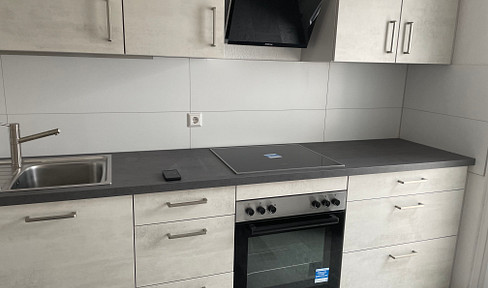 Bright apartment with fitted kitchen, balcony and garage