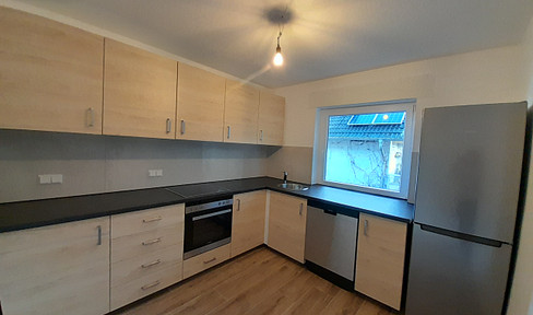 Modern 3-room apartment with balcony, fitted kitchen, and parking space in Mainz-Marienborn.