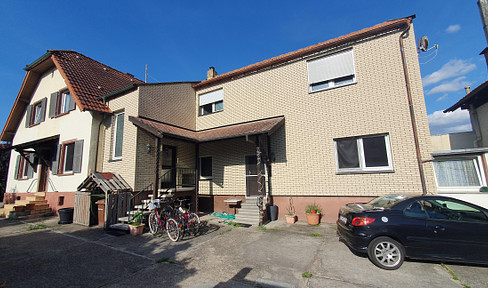 Unique two-family house with spacious plot and outbuildings