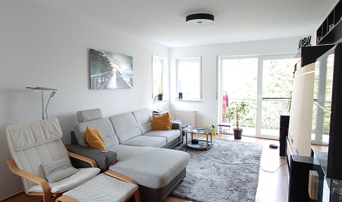 Spacious and bright 3-room apartment with 2 balconies, a fitted kitchen, and 2 parking spaces in an underground garage.