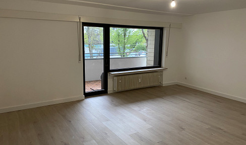 Modern 2-room apartment with balcony and fitted kitchen.