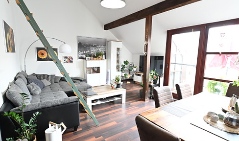 Modern apartment with sunny balcony and two galleries above the rooftops of Hennef's market square