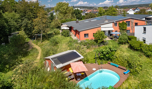 Live and work under one roof! Uniquely large natural garden, pool and Taunus view, plenty of space for living