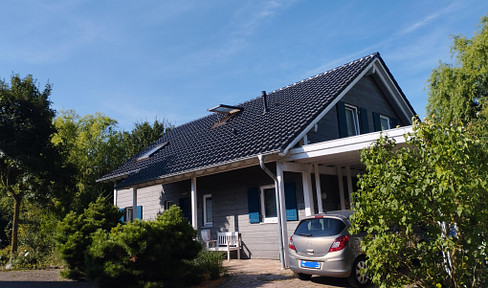 Baufritz wooden house with ingrown garden