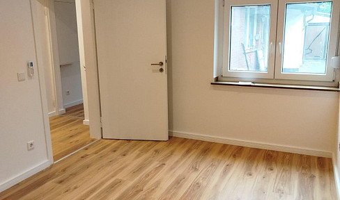 Charming living in a green setting: A small semi-detached house with its own garden.