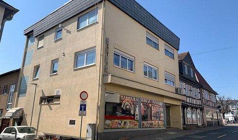 Apartment building with commercial space and stable rental potential in a prime location in Usingen