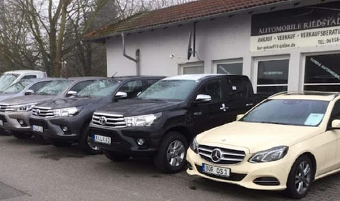 Car dealership with outdoor area and apartment