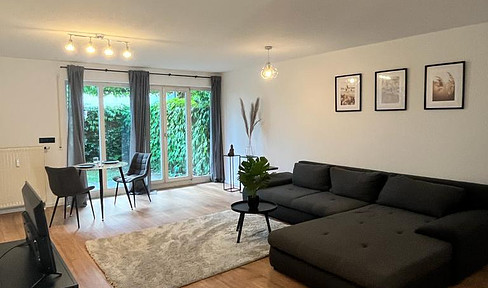 Attraktive Wohnung mit Terrasse, kleinem Garten und separatem Tiefgaragen-Stellplatz zu verkaufen