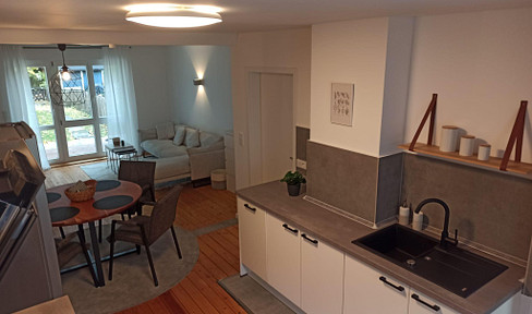 Renovated detached house in a prime location, featuring a kitchen and garden.