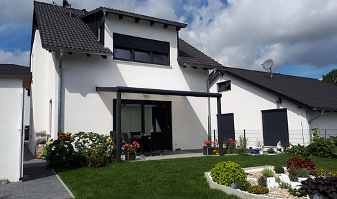 Detached house with garden in the Rotäcker development area