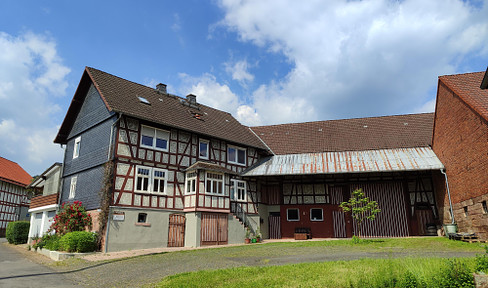 Renovated farm with barns and land on the outskirts of the village