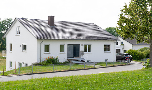 Two-family house with far-reaching views and building land in Bogenweiler