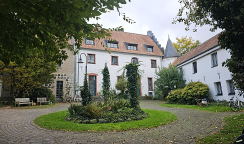 Light-flooded maisonette in an idyllic castle complex