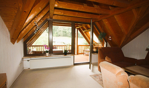 Semi-detached house with two 3 room apartments, one apartment rented, (terminated 30.09.25) quiet hillside location