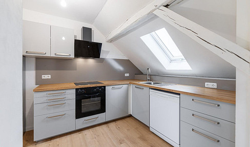 Beautiful 3-room attic apartment with a balcony and kitchen.