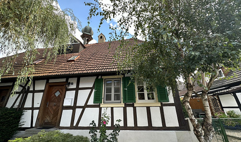 Charming half-timbered house with partial ownership (in shell construction) in outbuilding