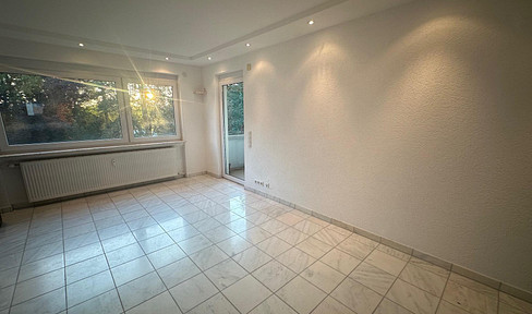 Modernized 3-room apartment with a balcony and views of greenery.