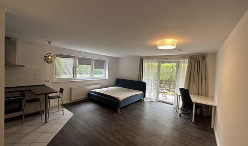 **Gut geschnittene 1 Zimmer Wohnung mit Terrasse inkl. Möbel und EBK**