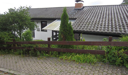 Detached small family home with large plot of land