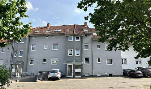 3-room apartment with a new fitted kitchen, terrace, small garden area, and garage, located in a pleasant area of Kirrlach.
