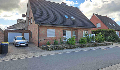 Modernized two-family house with underfloor heating and heat pump