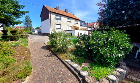 Well-kept 2-family house with beautiful garden!