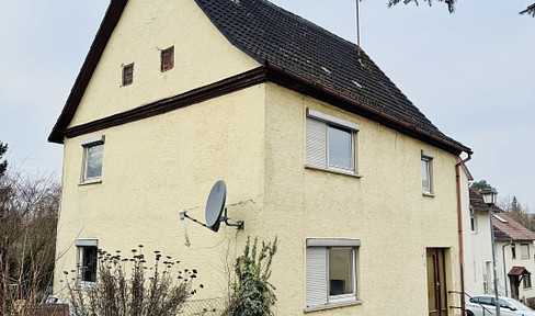 Detached house in need of renovation on the edge of a field for sale