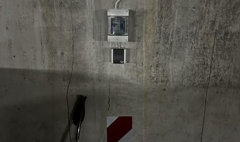 Underground parking space with 230 V power connection/meter