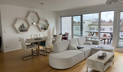 Exclusive 3.5-room penthouse apartment with a view of the Rhine, high-quality furnishings and a parking space