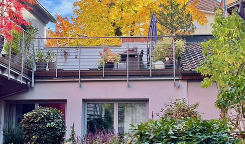 Aussergewöhnliche Maisonettewohnung in neuwertigem Zustand mit großer Südterrasse!