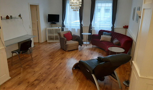 Spacious 2-room apartment in the city center with terrace and parking space