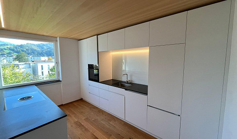 3-room apartment with a view, high-quality kitchen, and balcony, located in Dornbirn-Hatlerdorf.
