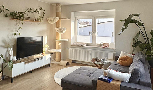 Modern 3-room apartment with access to a garden and a well-designed layout.