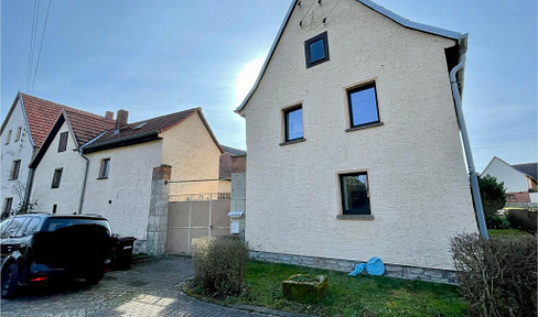 House and courtyard with upscale interior and workshop