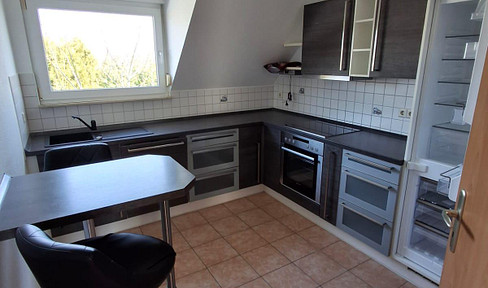 3-room apartment on the upper floor/ground floor with fitted kitchen, balcony and parking space