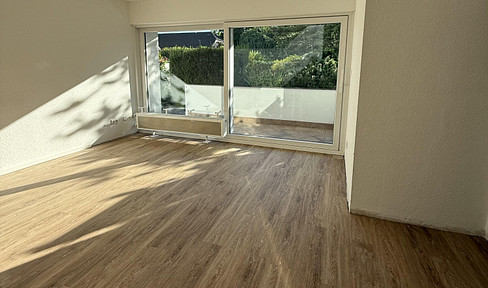 First-time occupancy after core renovation: Modern 3-room apartment with kitchen, parking space, balcony & garden